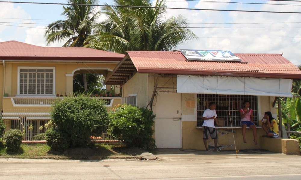 The family living quarters are on the second story of a house behind their store.